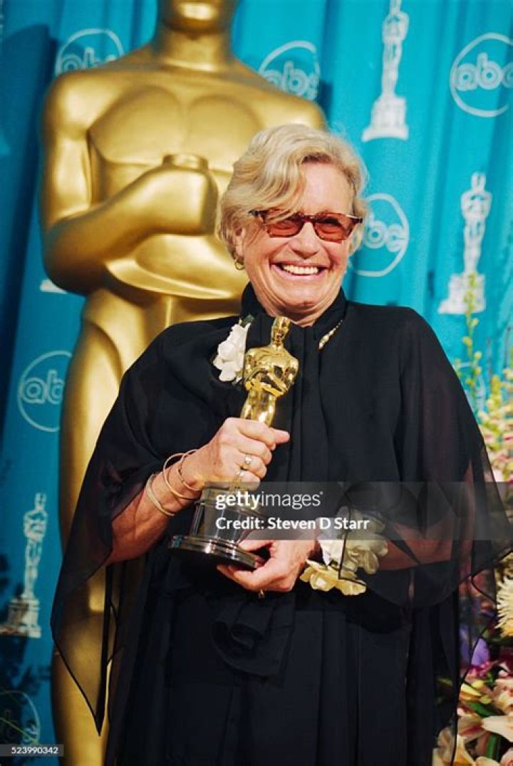 Ann Roth holding the Academy Award for Costume Design she received for