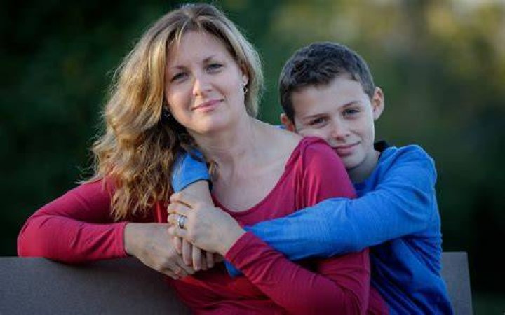 Captivating son holding his mom head no blur picture