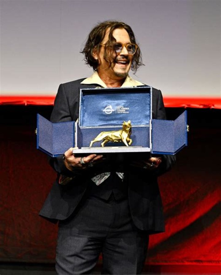 Johnny Paycheck receiving an award